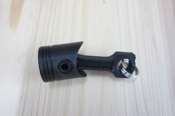 Schlüsselanhänger Kolben